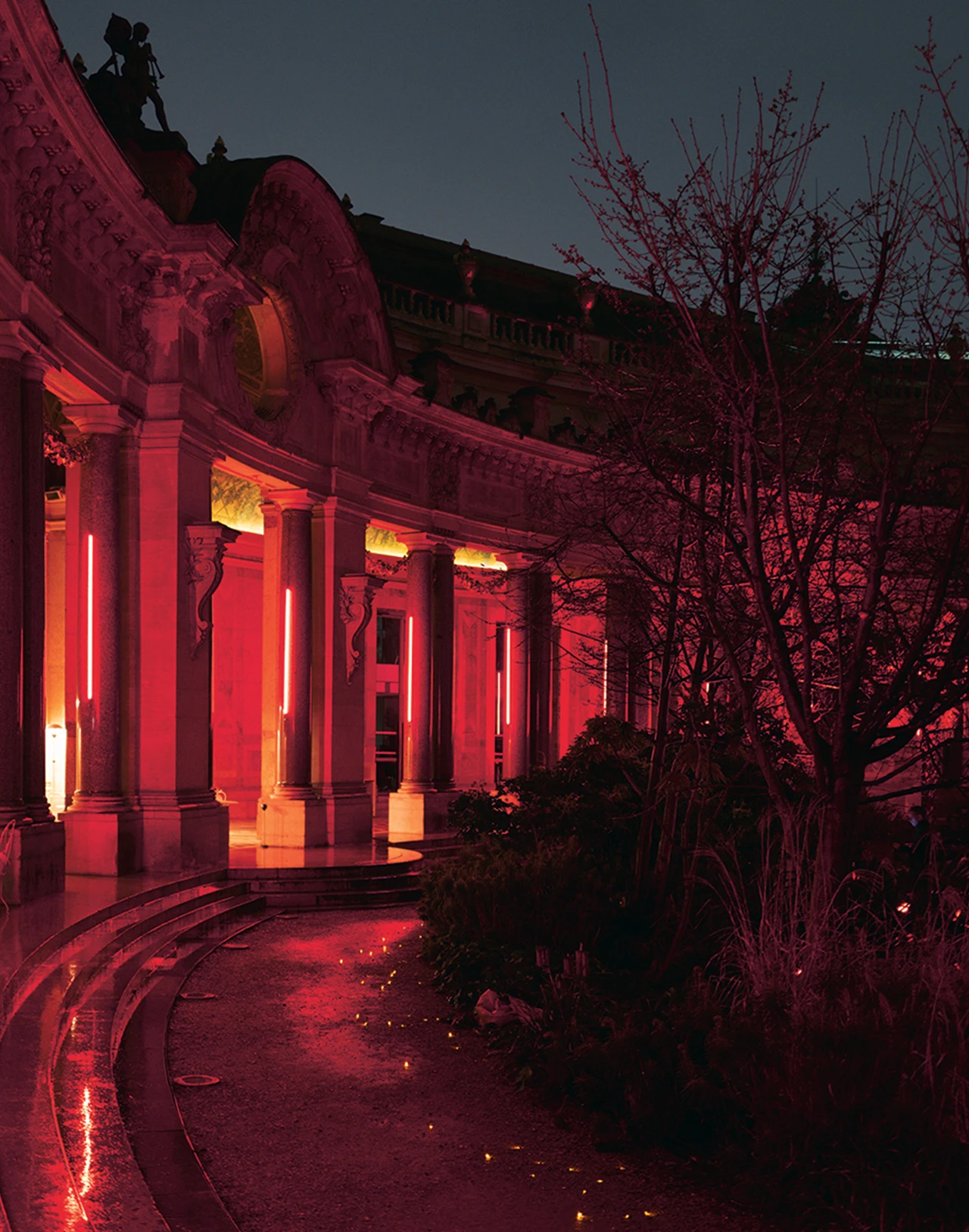 Photo of a Paris building with red lights